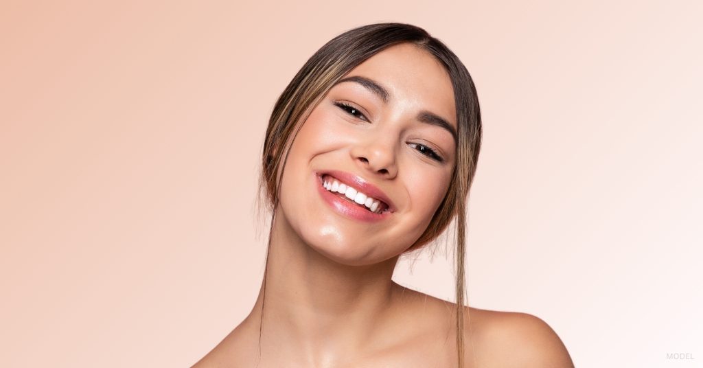 Woman with elegant nose line after rhinoplasty procedure. (Model)