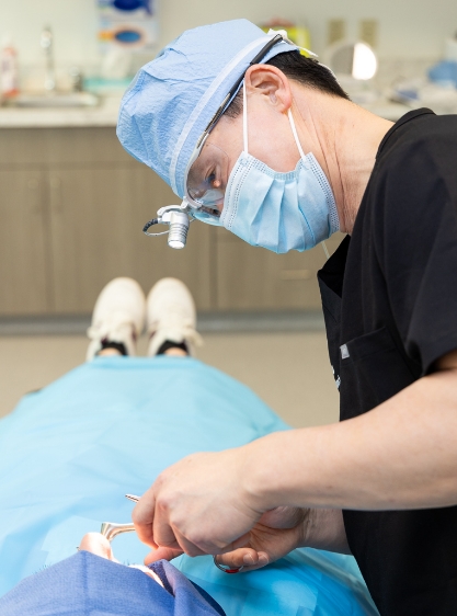 Dr. Chan, performing a facial cosmetic procedure.